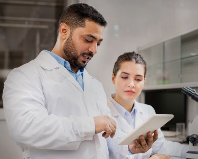 employees looking at tablet - collaborations section